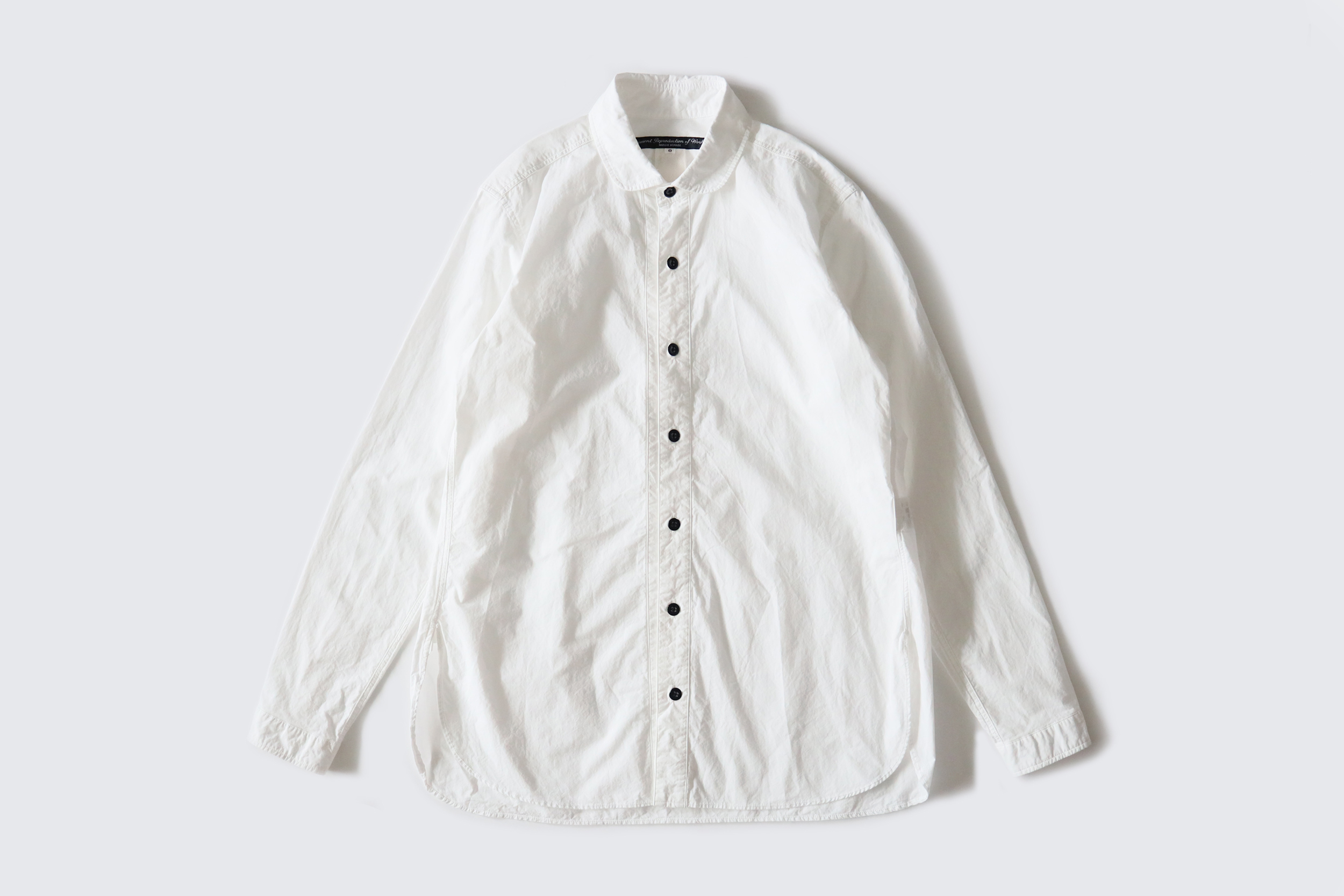 GARMENT REPRODUCTION OF WORKERS  Round collar shirt